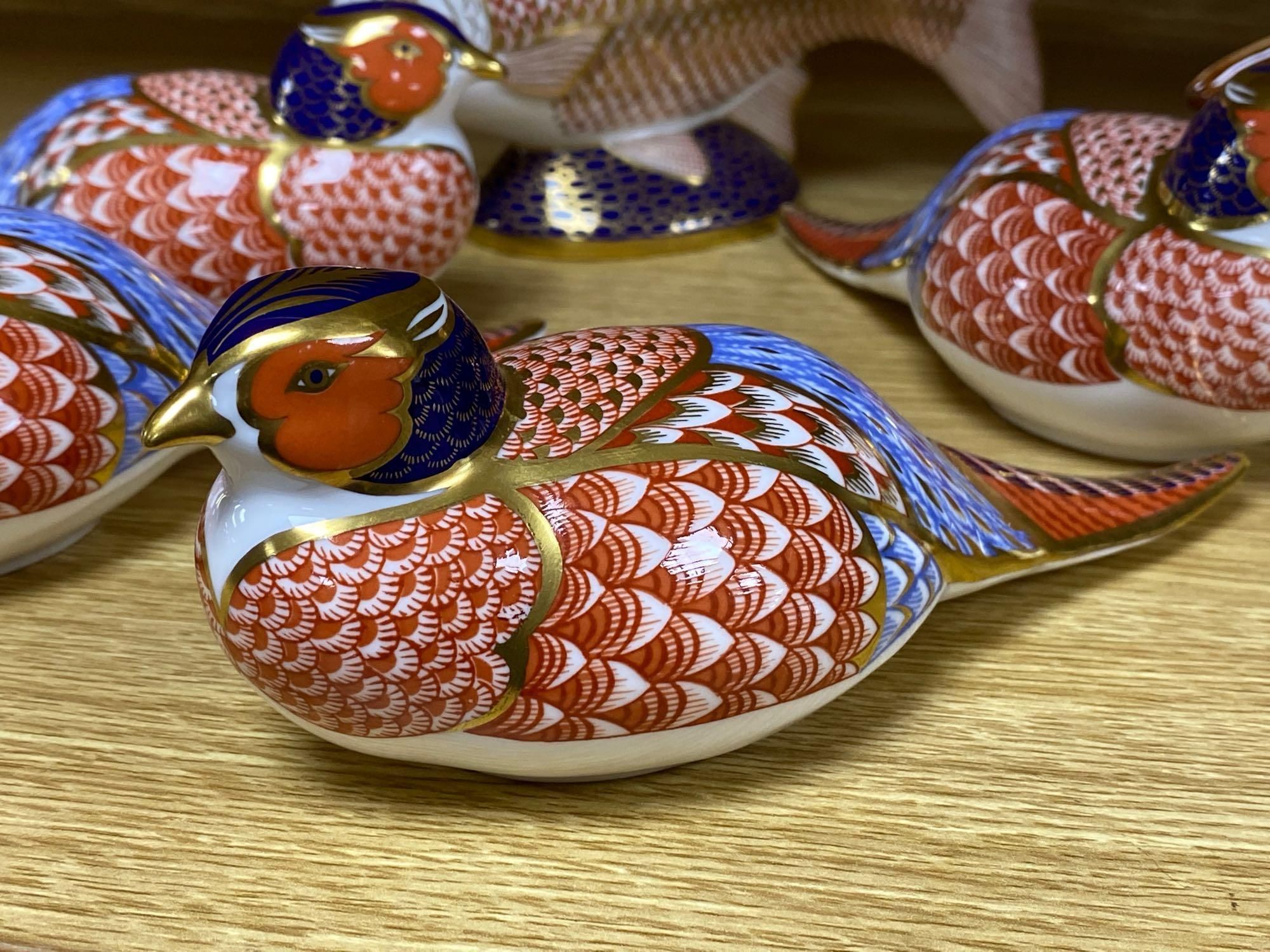A graduated set of Beswick flying ducks and five Royal Crown Derby animal paperweights and another similar rabbit, fish 18cm